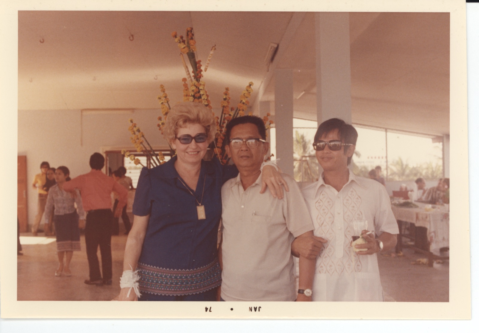 Mr. Bo with USAID officials on the rooftop of his home, 1975